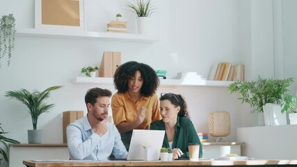 Canvas Print - Video of smart business people working together with laptop while talking in the coworking place