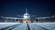 © realone952 - Close up of a passenger airliner on the runway at an airport in winter, at night in snowfall.