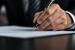 © TeteraX - A businessman writing on a blank sheet of paper at an elegant office desk