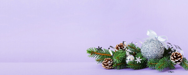 Wall Mural - New Year Christmas tree toy, branches of a christmas tree, New Year decorations on a colored background