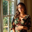 © Ronnachai - Pregnant woman embraces her journey by the window with a peaceful smile