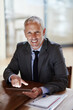 © peopleimages.com - Businessman, portrait and tablet for communication, development and client networking in office. Corporate lawyer, advocate and mature in law firm for conversation, legal research and review proposal