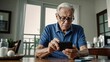 © Nailotl - Elderly man, examines directions on his smartphone.  Concept of digital health care.