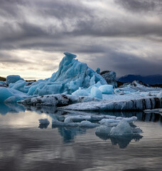 Wall Mural - beautiful blue icebergs reflected in the jokulsarlon glacial lagoon, southern iceland. part of the v