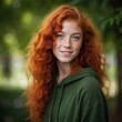 © Papatasi - Close-up portrait of a cheerful, beautiful, freckled teenage girl with bright green eyes and lush wavy red hair. High resolution photography with fine details.