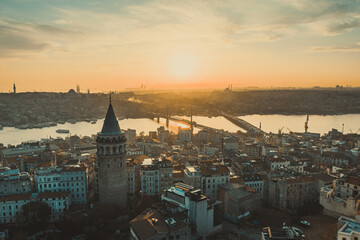 Galata Tower. Aerial view of Galata Tower at sunset. Golden Horn Metro Bridge are in the background. A unique view of Istanbul.