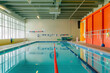 © Viktoriia - Professional lifeguard watching over a large indoor pool for safe swimming experience
