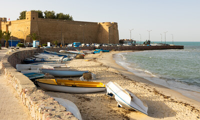 Wall Mural - Mediterranean sea and outer stone wall of fort surrounding old medina of Hammamet, Tunisia. Africa