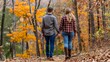 © Ilja - Couple Holding Hands, Enjoying Romantic Walk On Forest Trail Amidst Vibrant Fall Foliage