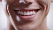 © Keopaserth - close up of smiling man showcasing bright, white teeth and cheerful expression. image captures warmth and positivity of genuine smile, set against neutral background