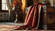 © siti - A red patterned fabric draped over a wooden chest in a luxuriously furnished room.