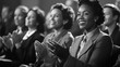 © Andrew - Applauding Success: A Black and White Image of Attentive Audience Appreciating a Presentation