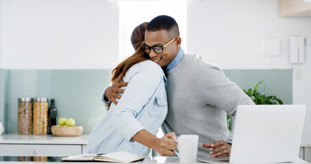 Wall Mural - Hug, laptop and couple in kitchen with coffee in morning for greeting, love and bonding together. Happy, computer and wife embracing man with remote work for marriage connection with care at in home.