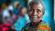 © somchai20162516 - Elderly woman sits while receiving vaccination at a community health center. Staff and nurses provide care with care and caution.