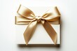 © nik_yurginson - Elegant golden gift card with a delicate bow isolated on a soft white background