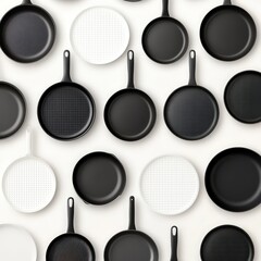 Wall Mural - Black and white frying pans in a flat lay pattern on a white background.