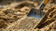 © Rasim - A spade shovel in action, efficiently removing sand, captures the essence of manual labor. This image of a spade shovel provides excellent visual content with ample copy space.