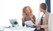 © peopleimages.com - Business women, documents and meeting with discussion for company finance, budget planning or expenses at office. Young, female people or employees discussing tax, paperwork or bills for revenue