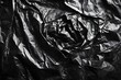 © shahadatarman 0 - Abstract black plastic texture with crumpled and wrinkled surface.