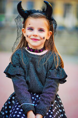 Wall Mural - halloween portrait of a child in a dress