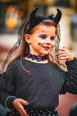 Wall Mural - halloween portrait of a child in a dress