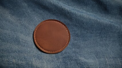 detailed close-up of round leather patch on denim, perfect for fashion
