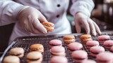 A pastry chef is making a tray of macaroons