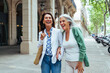 © oneinchpunch - Beautiful senior women bonding outdoors in the city - Attractive cheerful mature female friends having fun, shopping and bonding, concepts about elderly lifestyle