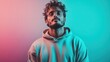 © Larisa AI - A thoughtful young man with curly hair and stylish glasses stands against a dynamic pink and blue background, showcasing a blend of modernity and introspection.