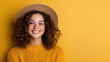 © Larisa AI - A young woman with a radiant smile wearing a hat and a cozy sweater, set against a vibrant yellow backdrop, exuding warmth and contentment in the image.