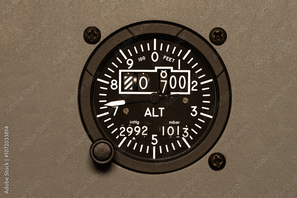 Cockpit Altimeter, set into the panel of a commercial aircraft. Used to ...