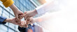 © Yingyaipumi - Panoramic Teamwork,empathy,partnership and Social connection in business join hand together concept.Hand of diverse people connecting.Power of volunteer charity work,Stack of people hand.
