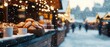 © Tararat - A snowy market scene with illuminated stalls showcasing delicious baked goods, creating a cozy winter atmosphere.