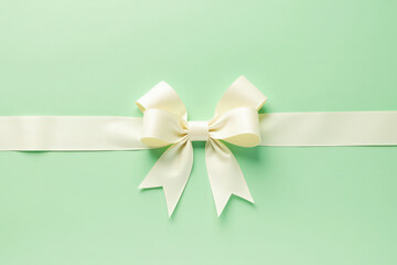 festive background a bow with a ribbon on a light green background