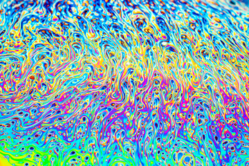 Wall Mural - Colorful light diffraction on a soap bubble surface with random swirls, curves and lines
