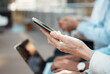 © aLListar/peopleimages.com - Hands, technology and waiting room in row for job opportunity, interview or onboarding. Group of people, business and together for feedback, networking and human resources agency with online as staff