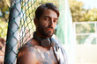 © peopleimages.com - Basketball, headphones and portrait with sports man on court of exercise, fitness or game in summer. Break, music and towel with confident athlete outdoor for challenge, competition or performance