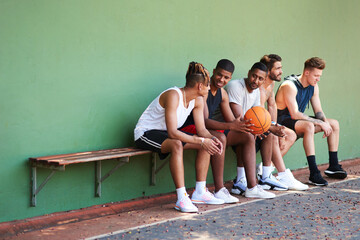 Wall Mural - Bench, basketball team or people relax on court for break, fitness exercise and wellness in sports match. Friends talking, athlete or group of healthy players resting for performance, workout or game