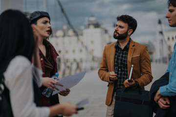 Sticker - A diverse group of business people engage in a thoughtful discussion outdoors in a city setting, holding documents and notebooks while dressed in smart attire.