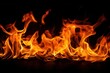 © oksa_studio - Fiery flames rising on a black background, isolated close-up