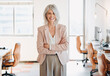 © peopleimages.com - Business, crossed arms and portrait of mature woman in office with confidence, company pride and happy. Professional, corporate manager and person in workplace with smile for career, job and ambition