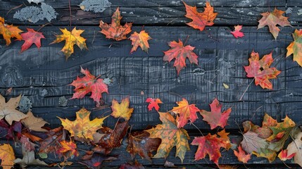 Wall Mural - Maple leaves in fall on wood surface with leafy backdrop.