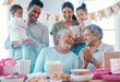 © peopleimages.com - Big family, senior couple and laughing with party, cake and love for home birthday celebration. Mature man, woman and parents with grandchildren, support and event for retirement and holiday bonding