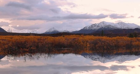 Wall Mural - scenic view of reflection lake in alaska during late autumn time.