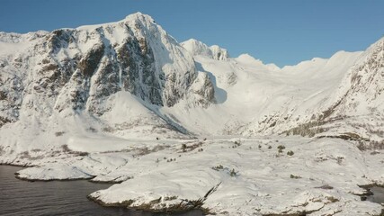 Wall Mural - 4k drone forward video (ultra high definition) of frozen vassdalsvatnet lake. aerial morning seascap
