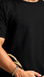 © Sergey - Mens black T-shirt mockup with wild grass and bracelet isolated with white highlights, png