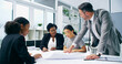 © peopleimages.com - Teamwork, blueprint and business people in meeting, architecture and coworking in modern office. Employees, staff and engineering with cooperation, ideas and paperwork with feedback and review plans