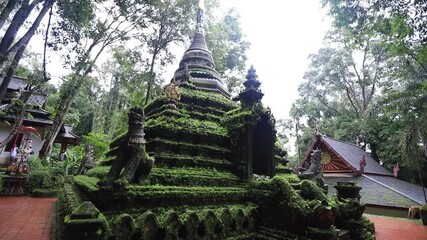 Wall Mural - Nature video background of the atmosphere inside the religious tourist attraction in the middle of nature Meditation Point of Pha Lat Fall, the way up to Doi Suthep, Chiang Mai, travelers always stop 