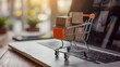 © creative - Product package boxes and shopping bag in cart with laptop computer which web store shop on screen for online shopping and delivery concept with miniature shopping cart standing in front of laptop