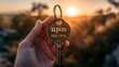 © MSH - Person holding the words upon success key, Sunset time a person holding success key